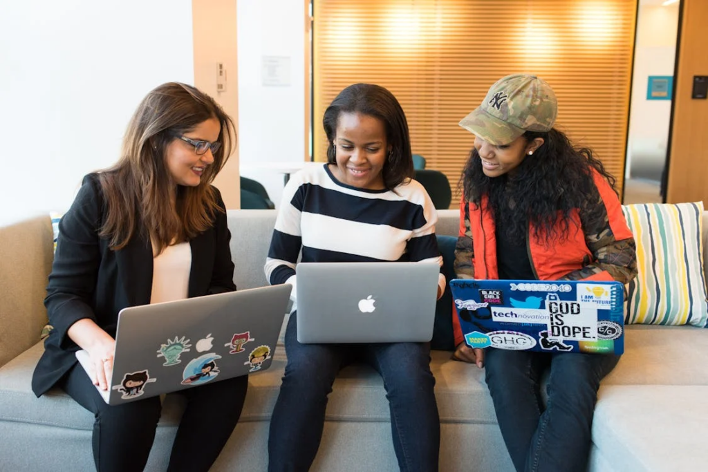 3 women with laptops